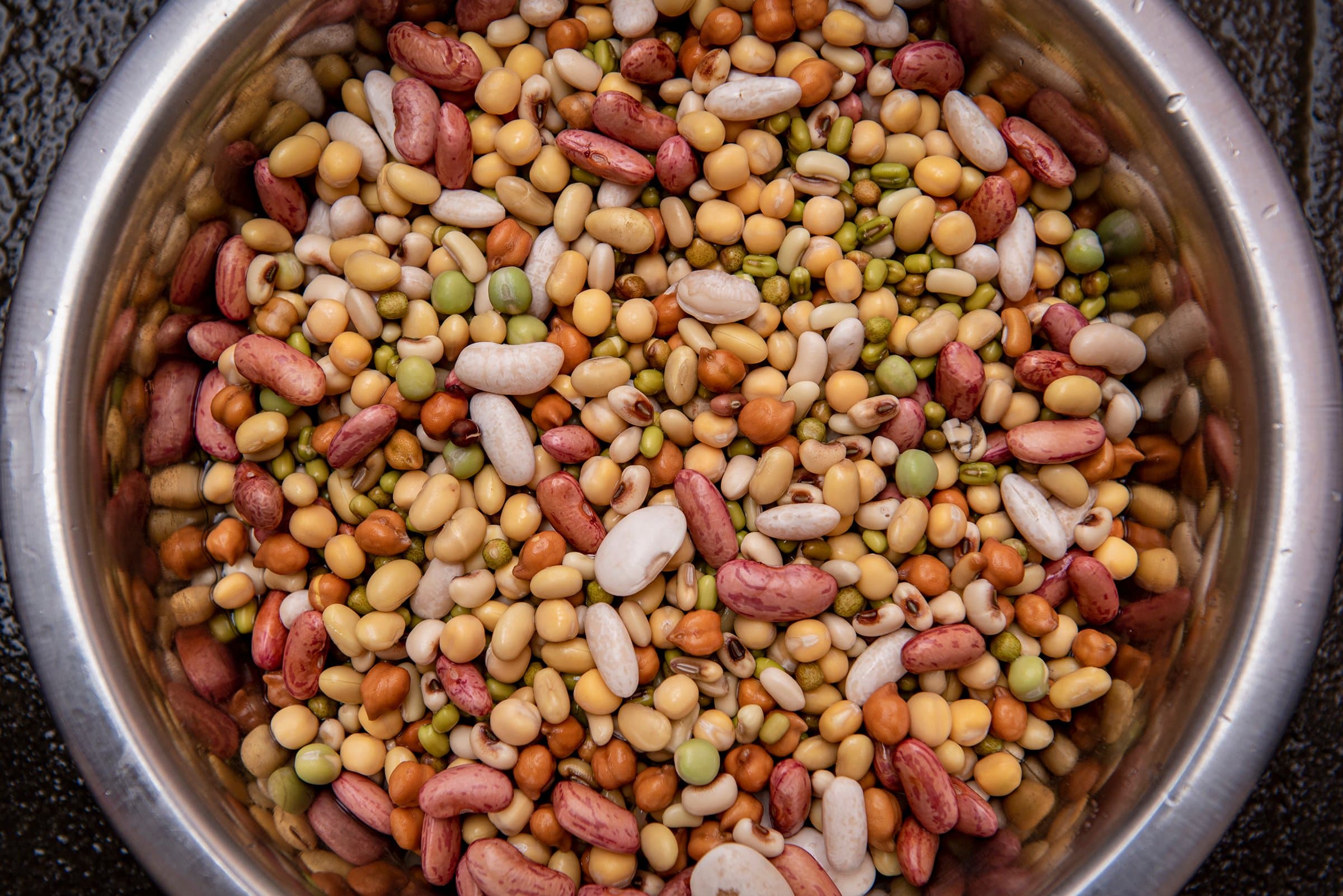 The mix of nine beans and pulses for kwati, soaking before they sprout